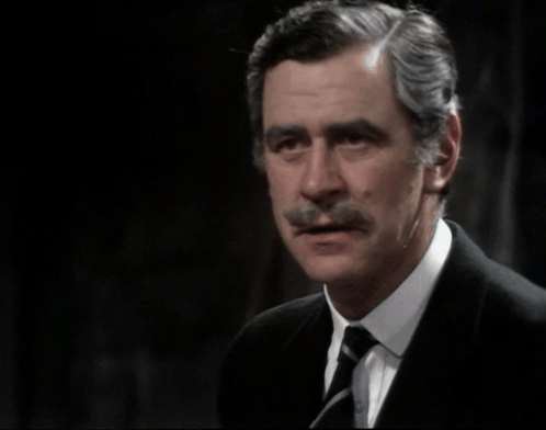 A Man In A Suit And Tie With The Words " They 'Re Not Half The Men They Were " Above Him GIF