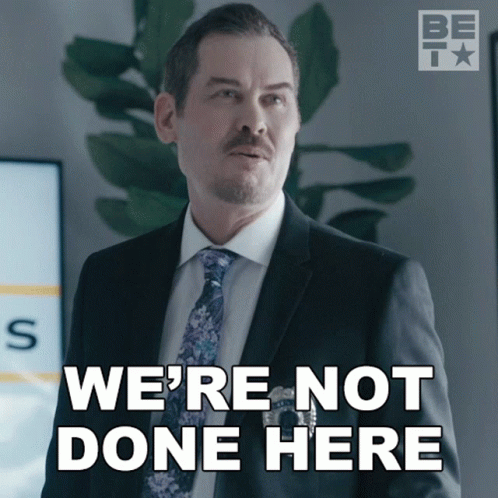 A Man In A Suit And Tie With The Words We 'Re Not Done Here GIF