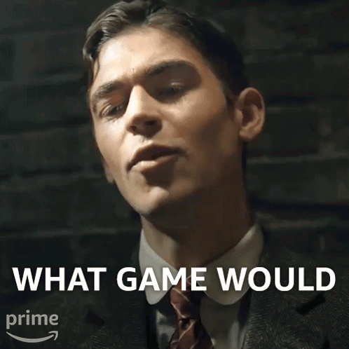 A Man In A Suit And Tie With The Words What Game Would Above Him GIF