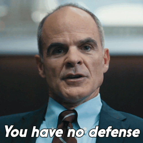 A Man In A Suit And Tie With The Words You Have No Defense Below Him GIF