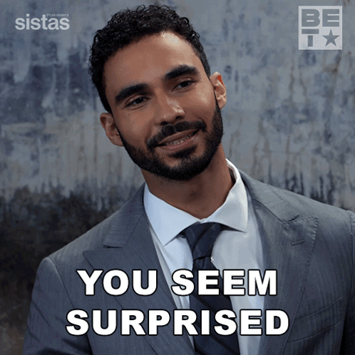 A Man In A Suit And Tie With The Words You Seem Surprised Below Him GIF
