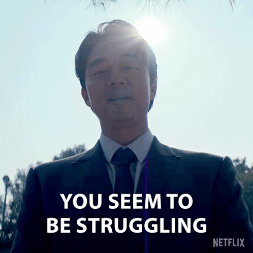 A Man In A Suit And Tie With The Words You Seem To Be Struggling On The Bottom GIF