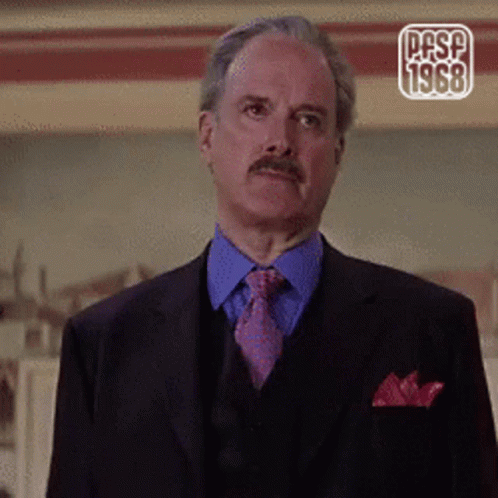 A Man In A Suit And Tie With The Year 1968 On The Corner GIF