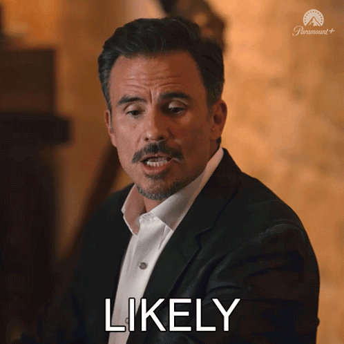 a man in a suit and white shirt is making a face and says likely