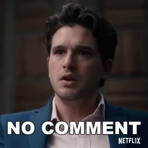 A Man In A Suit And White Shirt Is Making A No Comment Netflix Sign . GIF