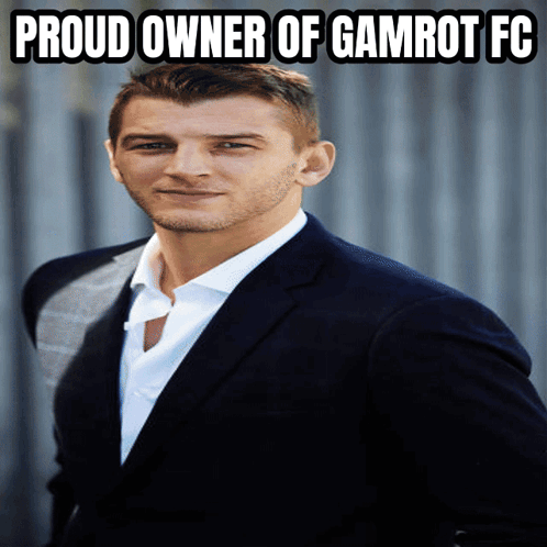 A Man In A Suit And White Shirt With The Words Proud Owner Of Gamrot Fc Above Him GIF