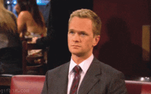 A Man In A Suit Giving The Middle Finger GIF