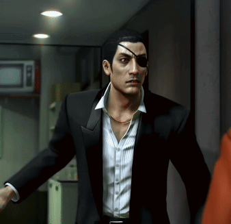A Man In A Suit Has A Bandage On His Eye GIF