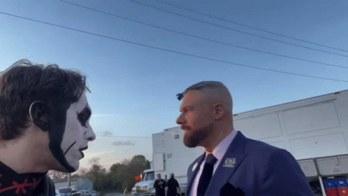 A Man In A Suit Has A Pin On His Lapel That Says Cbs GIF