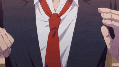 A Man In A Suit Has A Red Tie On His Neck GIF
