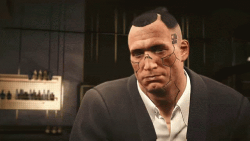 A Man In A Suit Has A Tattoo On His Face That Says ' Ss ' GIF