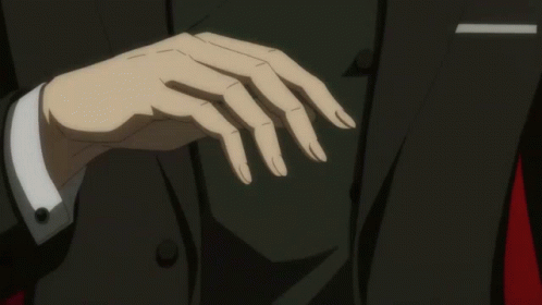 A Man In A Suit Holds His Finger To His Mouth GIF