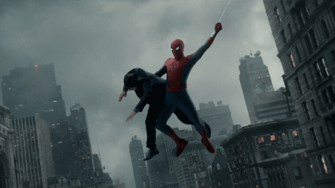 A Man In A Suit Is Being Lifted In The Air By A Spider-Man GIF