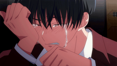 a man in a suit is crying with a tear running down his cheek