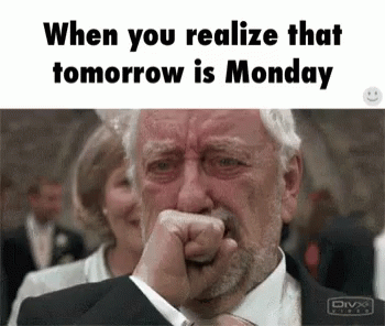 A Man In A Suit Is Crying With His Fist In His Mouth . GIF