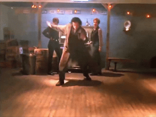 Man In Suit Dancing In Texas Room GIF