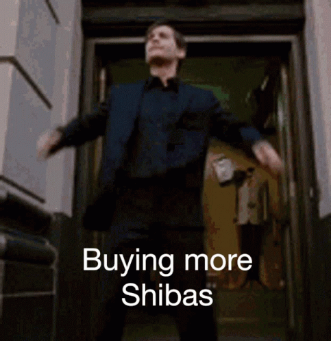A Man In A Suit Is Dancing In Front Of A Door That Says Buying More Shibas On It GIF