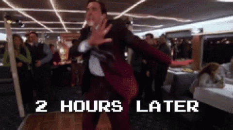 A Man In A Suit Is Dancing In Front Of A Sign That Says 2 Hours Later .. GIF