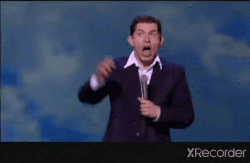 A Man In A Suit Is Dancing On A Stage With The Words " My Future Lies With Him " GIF