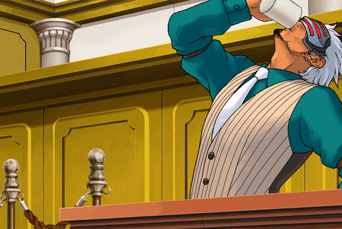 A Man In A Suit Is Drinking From A Cup GIF