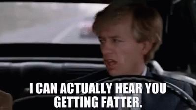 A Man In A Suit Is Driving A Car And Saying `` I Can Actually Hear You Getting Fatter . '' GIF