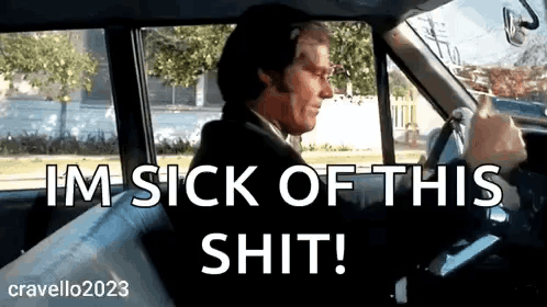 A Man In A Suit Is Driving A Car And Says I 'M Sick Of This Shit ! GIF