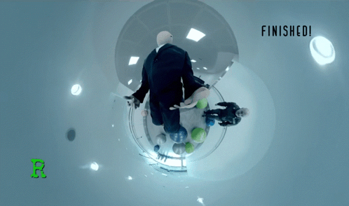 A Man In A Suit Is Flying Through A Bubble With The Words Finished Below Him GIF