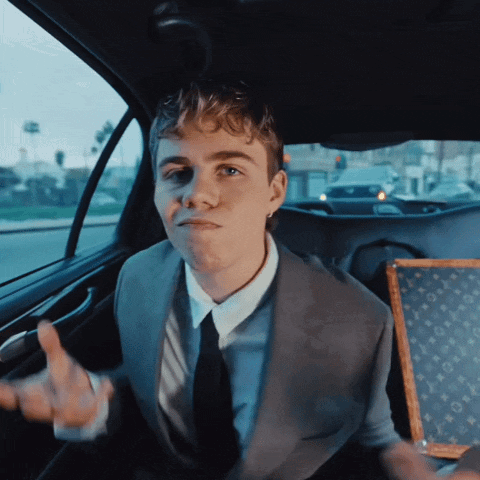 A Man In A Suit Is Giving The Middle Finger GIF