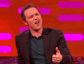 A Man In A Suit Is Giving The Thumbs Up Sign GIF
