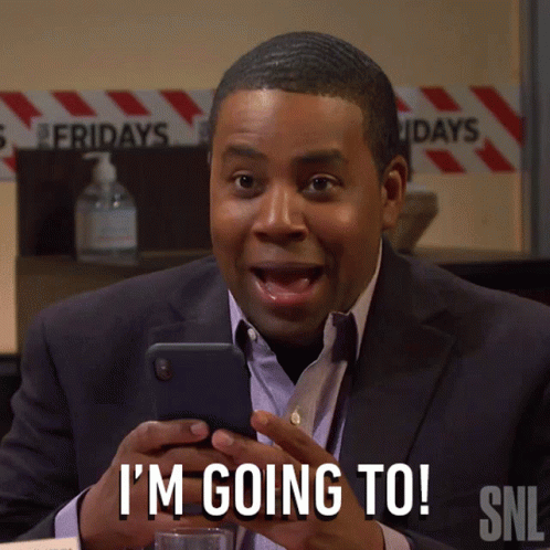 A Man In A Suit Is Holding A Cell Phone And Says I 'M Going To Snl GIF