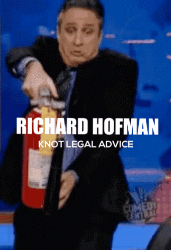 A Man In A Suit Is Holding A Fire Extinguisher And The Caption Says Richard Hofman GIF