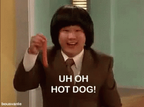 A Man In A Suit Is Holding A Hot Dog And Saying `` Uh Oh Hot Dog '' . GIF