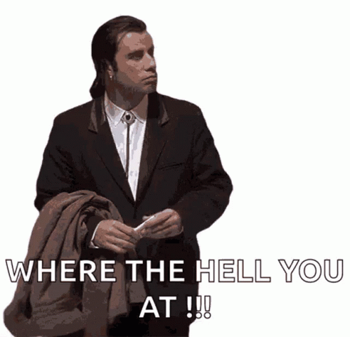 A Man In A Suit Is Holding A Jacket And Says Where The Hell You At !!! GIF