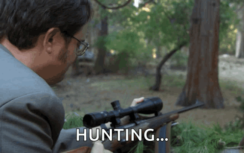 Man In Suit Holding Rifle Hunting GIF
