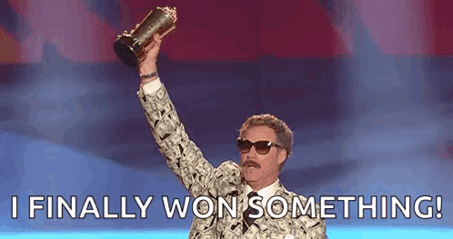 A Man In A Suit Is Holding A Trophy In His Hand And Saying `` I Finally Won Something '' . GIF