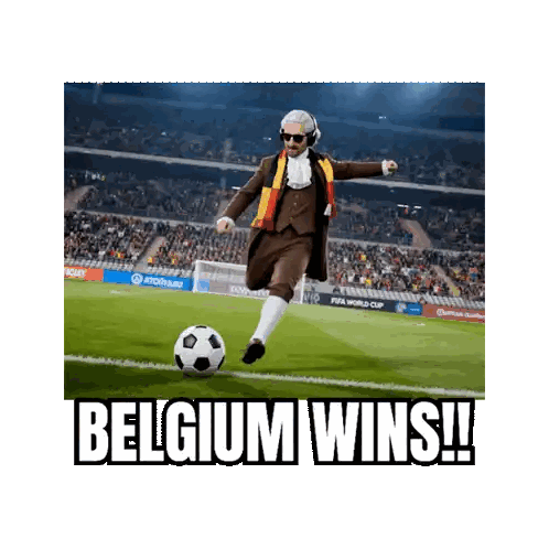 a man in a suit is kicking a soccer ball on a field with the caption belgium wins