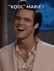 A Man In A Suit Is Laughing With The Words `` Kool '' Marie Written Above Him . GIF