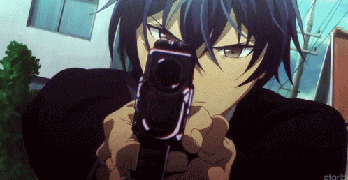 A Man In A Suit Is Pointing A Gun At The Camera .. GIF