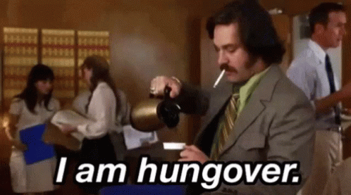 A Man In A Suit Is Pouring Coffee Into A Cup While Smoking A Cigarette And Saying `` I Am Hungover '' GIF