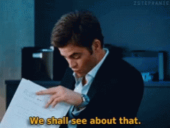 A Man In A Suit Is Reading A Piece Of Paper And Saying We Shall See About That GIF