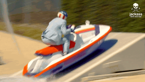 A Man In A Suit Is Riding A Jet Ski With The Words Jack Best And Fast Written On The Bottom GIF