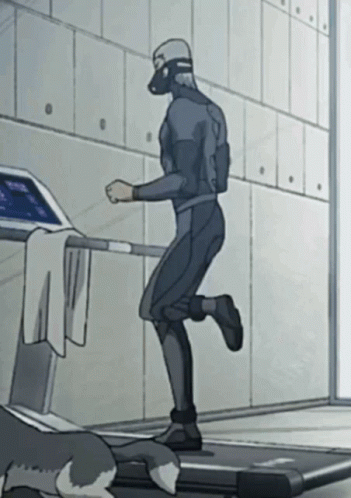 A Man In A Suit Is Running On A Treadmill GIF