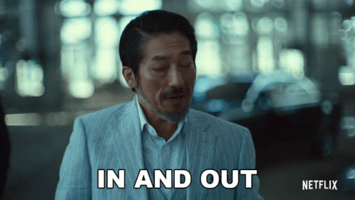 A Man In A Suit Is Saying In And Out GIF