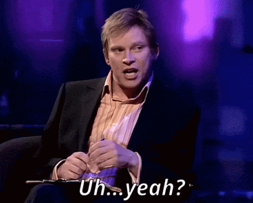 A Man In A Suit Is Saying Uh Yeah While Holding A Pen GIF