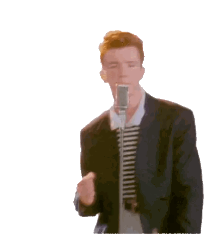 a man in a suit is singing into a microphone while wearing a striped shirt