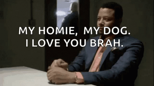 A Man In A Suit Is Sitting At A Table And Saying " My Homie , My Dog . I Love You Brah " GIF