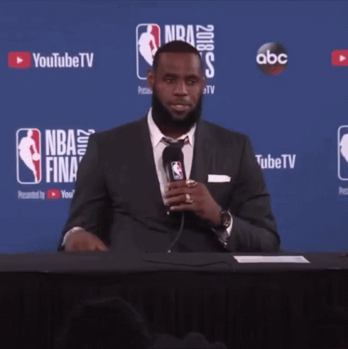 Man In Suit At NBA Finals Table GIF