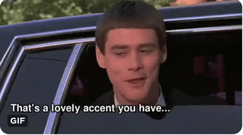A Man In A Suit Is Sitting In A Car And Says That 'S A Lovely Accent You Have . GIF