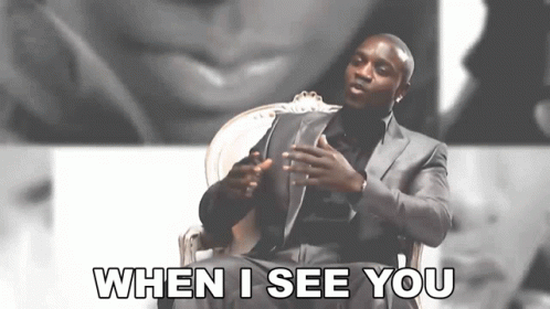 A Man In A Suit Is Sitting In A Chair And Saying When I See You GIF