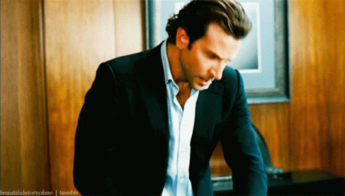 A Man In A Suit Is Sitting In Front Of A Wooden Wall And The Words Beautifulstoryofme Tumblr Can Be Seen Behind Him GIF